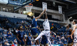 Cornelius Robinson III, 23, of the Monmouth Hawks goes up for a layup during an NCAA men's...