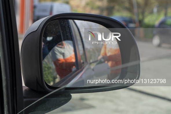 A person puts gas in a car in Lisbon, Portugal, on December 22, 2025. Petrol and diesel prices fall slightly this week following stability i... by Luis Boza/NurPhoto