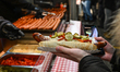 KRAKOW, POLAND – DECEMBER 22:A stall offering traditional grilled sausages is seen at the...