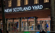 The illuminated facade of New Scotland Yard, the headquarters of the Metropolitan Police S...