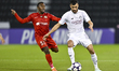 Boualem Khoukhi of Al Sadd SC and YURI Cesar Silva of Shabab Al Ahli are in action during...
