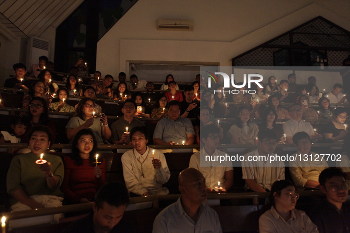 Worshippers Gather For Christmas Eve Candlelight Service In Indonesia