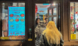 People dine, drink, and shop outdoors in London's Chinatown in the City of Westminster, En...