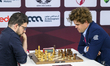 Magnus Carlsen of Norway competes against Maxime Vachier-Lagrave of France during the Rapi...