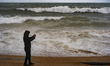 The Barcelona coastline is affected by a maritime storm, causing large waves, making parts...