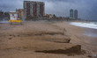 The Barcelona coastline is affected by a maritime storm, causing large waves, making parts...
