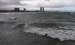 The Barcelona coastline is affected by a maritime storm, causing large waves, making parts...