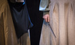 An Iranian actress holds a Harry Potter magic wand while performing in the play ''Harry Po...