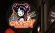 The logo of a branch of the noodle bar chain Chopstix Noodle Bar is in Sheffield, England,...