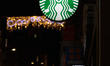 The Starbucks siren logo is on display outside a branch of the coffee shop chain in Sheffi...