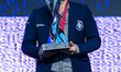 Gold medalist Magnus Carlsen of Norway poses with the trophy on the podium during the meda...