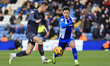 Luke Hannant of Oldham Athletic Association Football Club tussles with Tom Naylor of Chest...