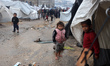 Palestinian displaced people inspect the damage to their temporary tents in Gaza City, Pal...
