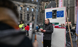 A group of protesters assembles at Dam Square in Amsterdam, Netherlands, on January 3, 202...