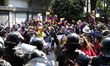 Riot police prevent protesters from reaching the US embassy during a demonstration against...