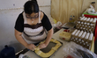 Bakers in the Tlahuac borough of Mexico City prepare Rosca de Reyes (Three Kings' Bread) t...