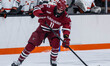 JUSTIN SOLOVEY (11) of the Harvard Crimson possesses the puck during an NCAA men's ice hoc...
