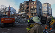 Rescuers work during emergency rescue operations at the site of a Russian missile strike i...