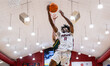 FLASH BURTON (11) of the Rider Broncs goes up for a layup during an NCAA men's basketball...