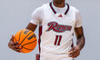 FLASH BURTON (11) of the Rider Broncs possesses the ball during an NCAA men's basketball g...
