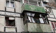 Broken windows in a multi-storey residential building are seen following a Russian drone a...