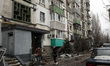 Broken windows in a multi-storey residential building are seen following a Russian drone a...