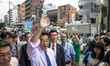TOKYO, JAPAN - JULY 6 : Katsuya Okada President of Democratic Party of Japan (DPJ) waves h...