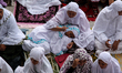 Indonesian muslims perform Eid el-Fitr prayer at Islamic Centre in Lhokseumawe, Aceh Provi...