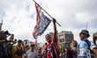 Retirees and people with disabilities demonstrate outside the Argentine National Congress...