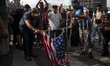 Retirees and people with disabilities demonstrate outside the Argentine National Congress...