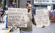 Retirees and people with disabilities demonstrate outside the Argentine National Congress...