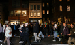 Demonstrators march to the White House in Washington, D.C. on January 8, 2026 to protest t...