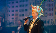 Christoph Kuckelkorn, the president of the Cologne carnival committee, speaks on the stage...