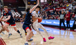 Derek Simpson of the St. Joseph's Hawks drives the ball during an NCAA men's basketball ga...
