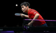 Lin Shidong of China competes against Liang Jingkun of China during a men's singles quarte...