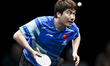 Liang Jingkun of China competes against Lin Shidong of China during a men's singles quarte...