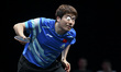 Liang Jingkun of China competes against Lin Shidong of China during a men's singles quarte...