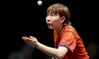 Zhu Yuling of Macao, China, competes against Wang Yidi of China during a women's singles q...