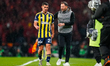 Domenico Tedesco of Fenerbahce gives instructions to Levent Mercan of Fenerbahce during th...