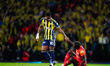 Jhon Duran of Fenerbahce helps Davinson Sanchez of Galatasaray to get up during the Super...