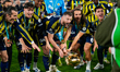 Milan Skriniar of Fenerbahce lifts the trophy during the Super Cup final between Galatasar...