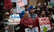 Protesters gather outside City Hall in Houston, Texas, on January 10, 2026, for a demonstr...