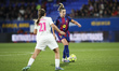 Alexia Putellas of FC Barcelona controls the ball while being defended by Marina Rivas of...
