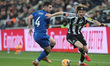 Anthony Gordon of Newcastle United is in action with Lewis Cook of Bournemouth during the...