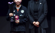 Zhu Yuling of China's Macao, the winner, poses with the trophy alongside Petra Sorling, Pr...
