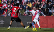 Pep Chavarria of Rayo Vallecano (R) is in action with the ball during the LaLiga EA Sports...