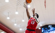 Elijah Lewis (13) of the Marist Red Foxes goes up for a layup during an NCAA men's basketb...