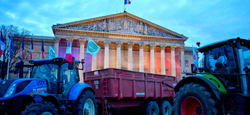 Gallery cover photo: French Farmers Protest And Sleep In Paris With Tractor Convoy