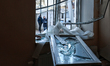 An insulated glass unit lies on the windowsill in an apartment block damaged by a Russian...