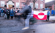 People display the flag of Greenland as they take part in a demonstration titled ''Greenla...